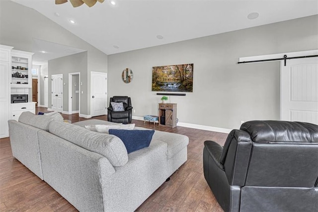 9425 NE 188th St, Trimble, MO 64492 - living area with a barn door, wood finished floors, high vaulted ceiling, recessed lighting, and a ceiling fan
