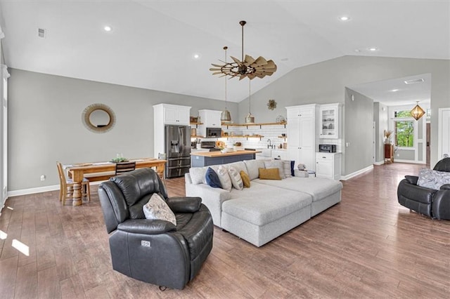 9425 NE 188th St, Trimble, MO 64492 - living room featuring wood finished floors, a ceiling fan, recessed lighting, and high vaulted ceiling