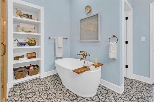 9425 NE 188th St, Trimble, MO 64492 - full bathroom featuring a freestanding bath, built in shelves, and tile patterned flooring