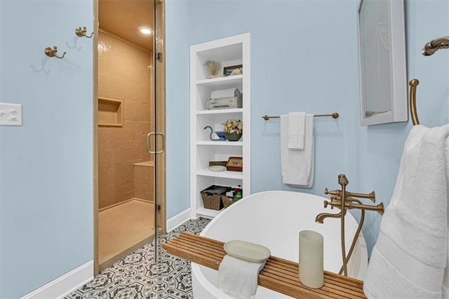 9425 NE 188th St, Trimble, MO 64492 - bathroom featuring a shower stall, a freestanding bath, and built in features