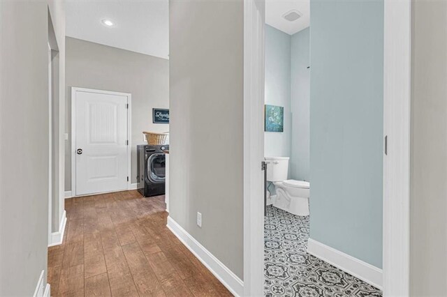 9425 NE 188th St, Trimble, MO 64492 - hallway featuring washer / clothes dryer, wood finished floors, and recessed lighting