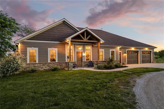 9425 NE 188th St, Trimble, MO 64492 - craftsman inspired home featuring an attached garage, a lawn, stone siding, and driveway