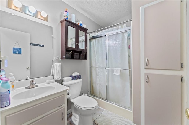 800 Tyler Ave, Warrensburg, MO 64093 - bathroom with a textured ceiling, a shower with shower curtain, toilet, and vanity