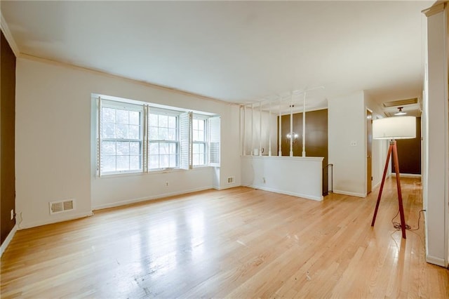 15609 E 43rd St S, Independence, MO 64055 - unfurnished living room featuring light wood finished floors, baseboards, and crown molding