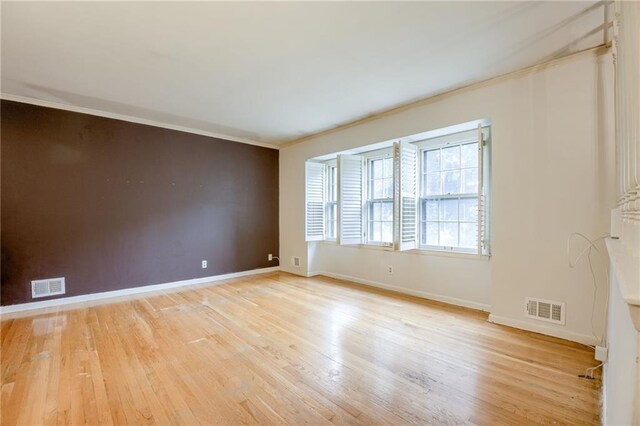 15609 E 43rd St S, Independence, MO 64055 - spare room with light wood-type flooring, baseboards, and crown molding