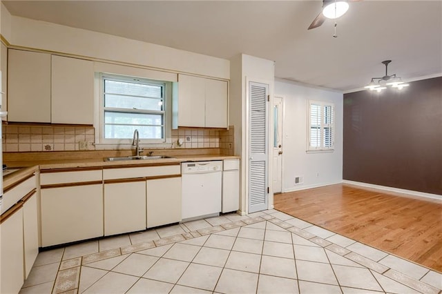 15609 E 43rd St S, Independence, MO 64055 - kitchen with dishwasher, a sink, light tile patterned floors, and light countertops