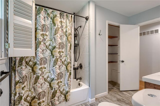 15609 E 43rd St S, Independence, MO 64055 - full bathroom featuring toilet, wood finished floors, shower / tub combo with curtain, and vanity