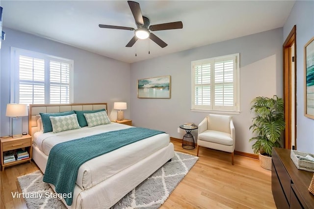 15609 E 43rd St S, Independence, MO 64055 - bedroom with multiple windows, wood finished floors, baseboards, and a ceiling fan