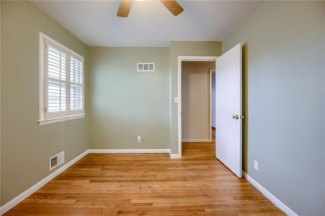 15609 E 43rd St S, Independence, MO 64055 - unfurnished room with ceiling fan, light wood-type flooring, and baseboards