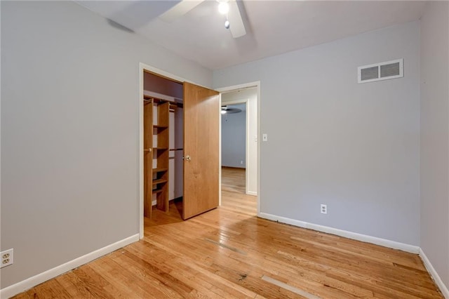 15609 E 43rd St S, Independence, MO 64055 - unfurnished bedroom with light wood-type flooring, baseboards, a closet, and a ceiling fan