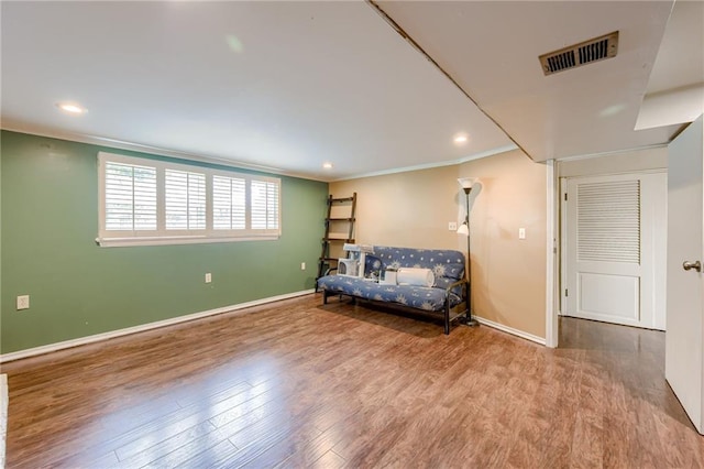 15609 E 43rd St S, Independence, MO 64055 - sitting room featuring wood finished floors, baseboards, recessed lighting, and crown molding
