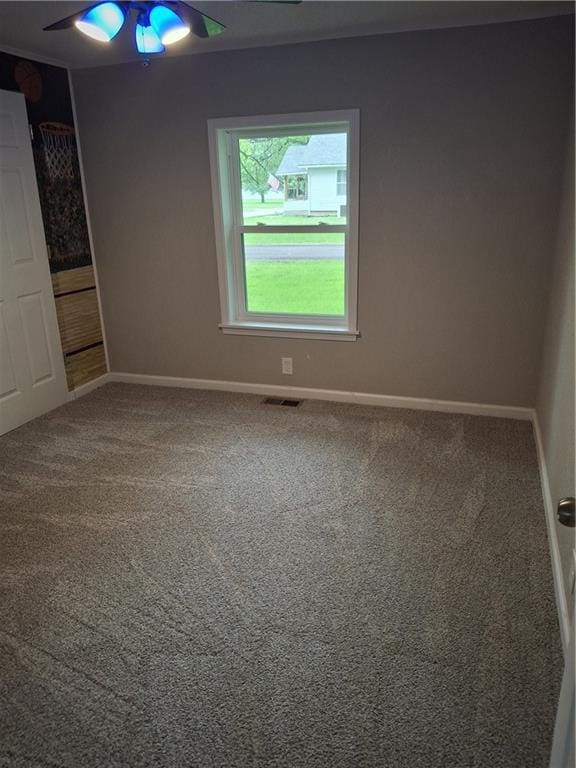 715 E Blackhawk St, Ottawa, KS 66067 - carpeted spare room featuring ceiling fan and baseboards
