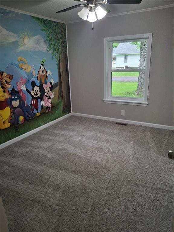 715 E Blackhawk St, Ottawa, KS 66067 - unfurnished room with crown molding, a ceiling fan, baseboards, and carpet