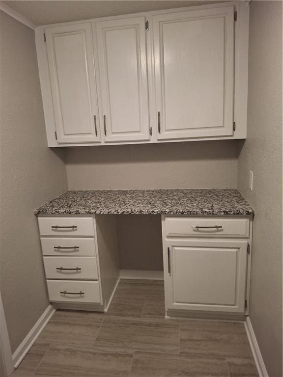 715 E Blackhawk St, Ottawa, KS 66067 - unfurnished office featuring built in study area and baseboards