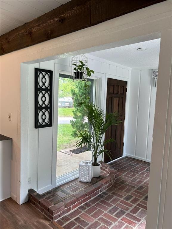 1702 Countryside Dr, Pittsburg, KS 66762 - foyer featuring brick flooring and beamed ceiling