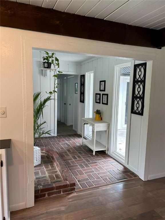 1702 Countryside Dr, Pittsburg, KS 66762 - entryway with beam ceiling and brick floors
