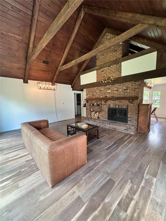 1702 Countryside Dr, Pittsburg, KS 66762 - living area with wooden ceiling with exposed beams, hardwood / wood-style floors, a fireplace, and high vaulted ceiling