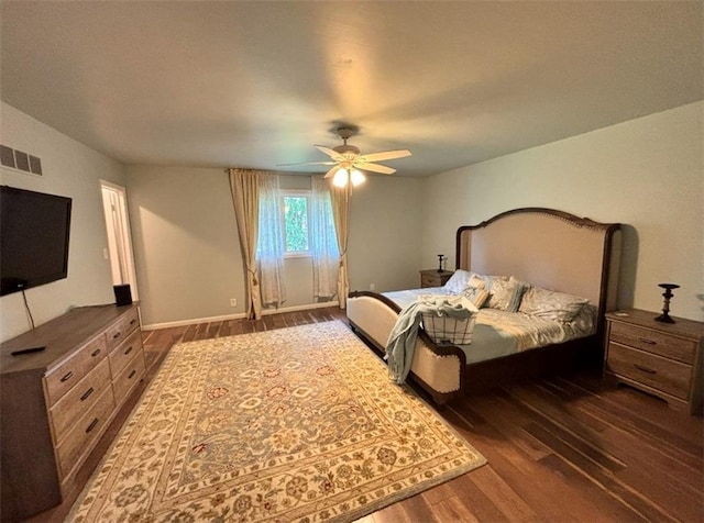 1702 Countryside Dr, Pittsburg, KS 66762 - bedroom with wood finished floors, a ceiling fan, and baseboards