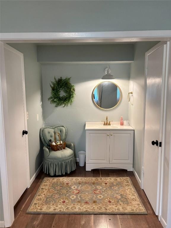 1702 Countryside Dr, Pittsburg, KS 66762 - bathroom featuring vanity, wood finished floors, and baseboards
