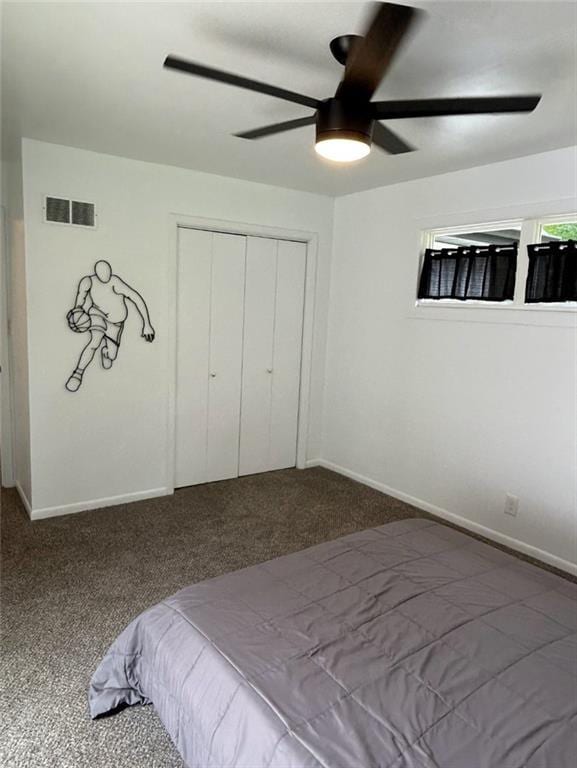 1702 Countryside Dr, Pittsburg, KS 66762 - carpeted bedroom featuring a closet, ceiling fan, and baseboards
