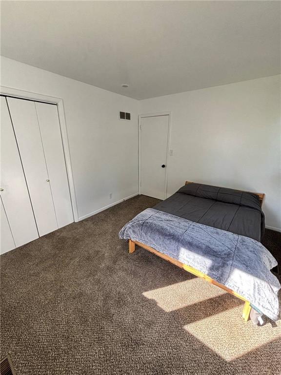1702 Countryside Dr, Pittsburg, KS 66762 - carpeted bedroom featuring a closet