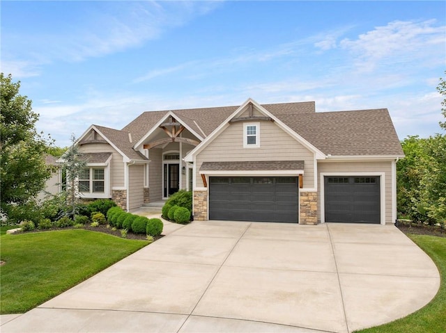 20611 W 113th St, Olathe, KS 66061 - craftsman house featuring driveway, a front yard, stone siding, roof with shingles, and a garage
