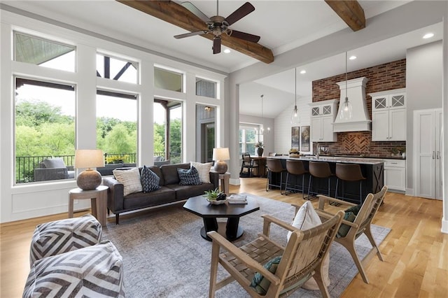 20611 W 113th St, Olathe, KS 66061 - living room with beamed ceiling, light wood finished floors, ceiling fan, recessed lighting, and high vaulted ceiling