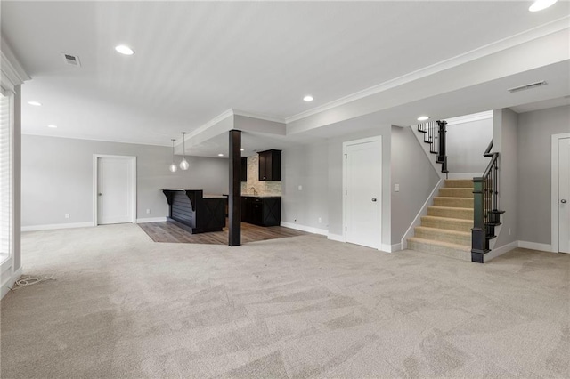 20611 W 113th St, Olathe, KS 66061 - unfurnished living room featuring light carpet, stairway, recessed lighting, and crown molding