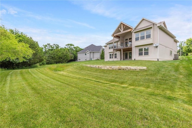 20611 W 113th St, Olathe, KS 66061 - rear view of property featuring a lawn and a balcony