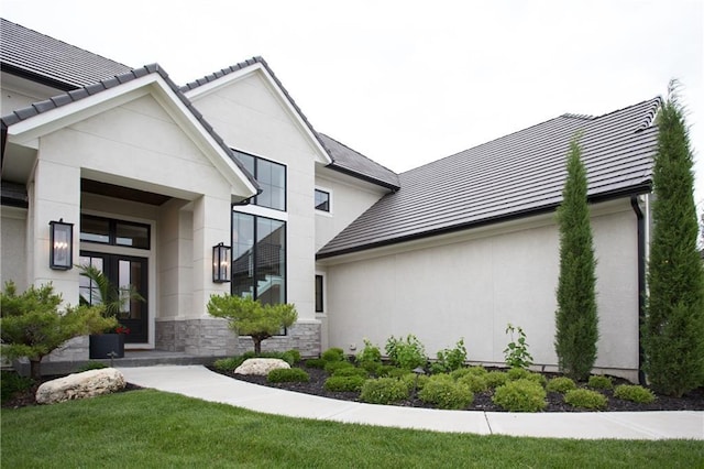 10702 W 142nd Ter, Overland Park, KS 66221 - view of exterior entry with stone siding and stucco siding