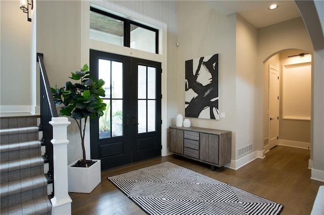 10702 W 142nd Ter, Overland Park, KS 66221 - entrance foyer with french doors, arched walkways, plenty of natural light, wood finished floors, and recessed lighting
