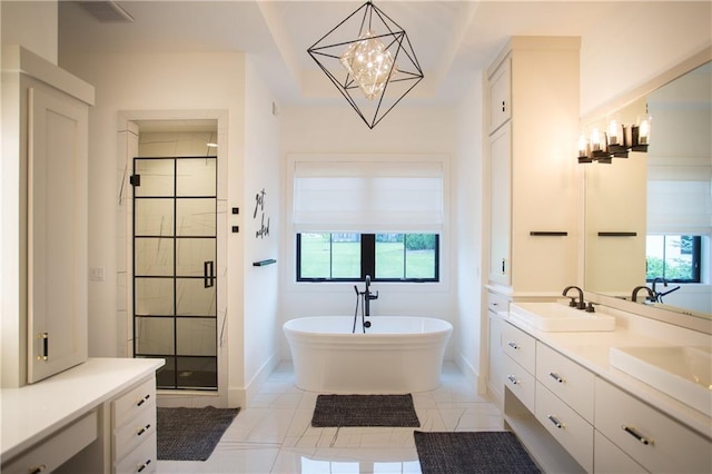 10702 W 142nd Ter, Overland Park, KS 66221 - full bathroom featuring a stall shower, a freestanding bath, a chandelier, double vanity, and baseboards