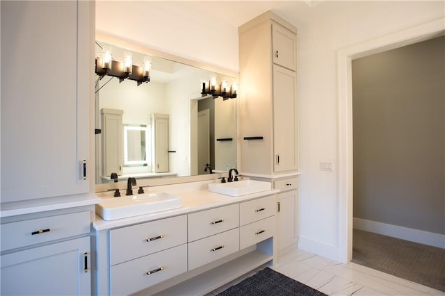 10702 W 142nd Ter, Overland Park, KS 66221 - full bathroom featuring double vanity and baseboards