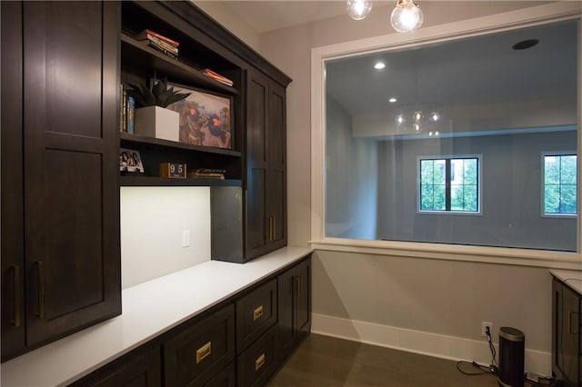 10702 W 142nd Ter, Overland Park, KS 66221 - mudroom featuring baseboards and dark wood finished floors