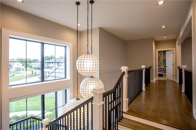 10702 W 142nd Ter, Overland Park, KS 66221 - corridor featuring an upstairs landing, recessed lighting, wood finished floors, and baseboards