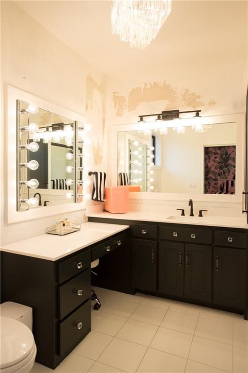 10702 W 142nd Ter, Overland Park, KS 66221 - full bathroom with toilet, a chandelier, tile patterned flooring, vanity, and a towel warmer
