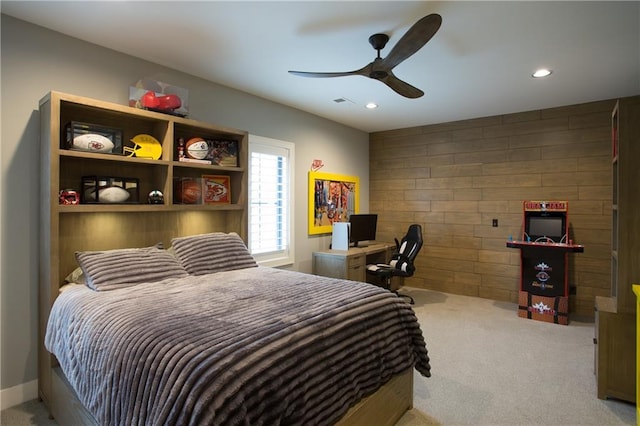 10702 W 142nd Ter, Overland Park, KS 66221 - carpeted bedroom featuring recessed lighting, an accent wall, a ceiling fan, and wooden walls