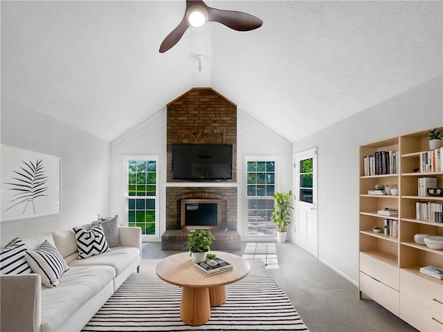 2157 E 154th St, Olathe, KS 66062 - living area featuring lofted ceiling, a brick fireplace, a ceiling fan, healthy amount of natural light, and carpet floors