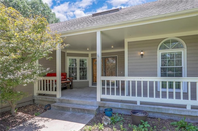 1875 E Mechanic Ave, Independence, MO 64050 - view of exterior entry with covered porch and a shingled roof