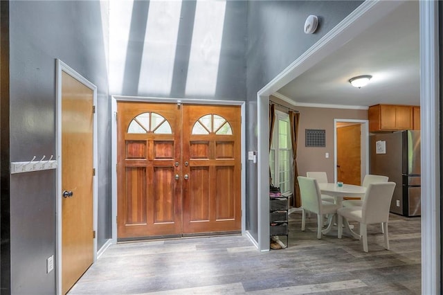 1875 E Mechanic Ave, Independence, MO 64050 - foyer entrance with wood finished floors and crown molding