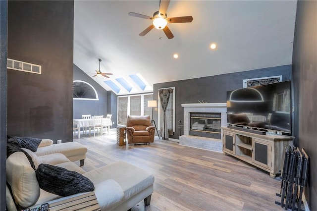 1875 E Mechanic Ave, Independence, MO 64050 - living room with ceiling fan, wood finished floors, vaulted ceiling, a fireplace, and recessed lighting