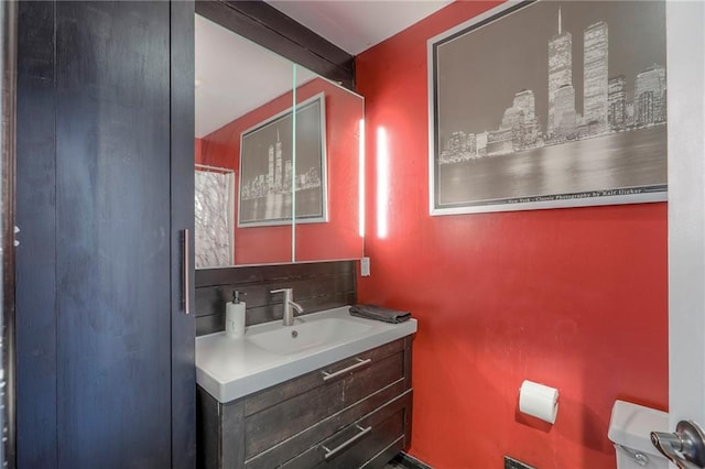 1875 E Mechanic Ave, Independence, MO 64050 - bathroom with vanity and decorative backsplash
