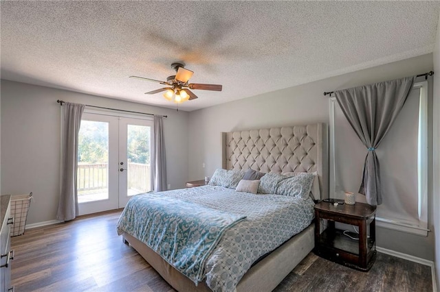 1875 E Mechanic Ave, Independence, MO 64050 - bedroom featuring french doors, access to exterior, dark wood-style flooring, a textured ceiling, and a ceiling fan