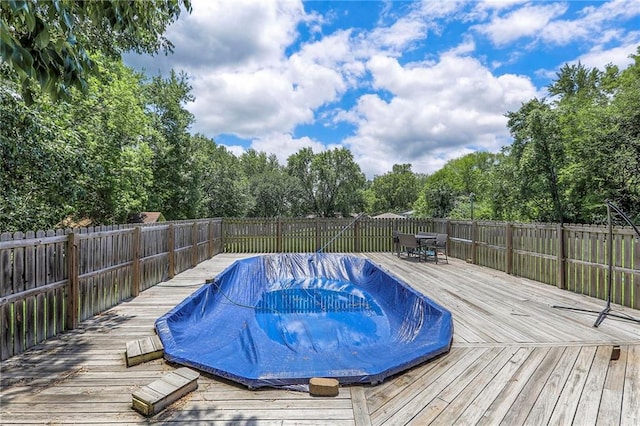 1875 E Mechanic Ave, Independence, MO 64050 - view of pool featuring outdoor dining space, a fenced backyard, and a deck