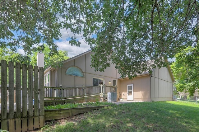 1875 E Mechanic Ave, Independence, MO 64050 - rear view of property with board and batten siding