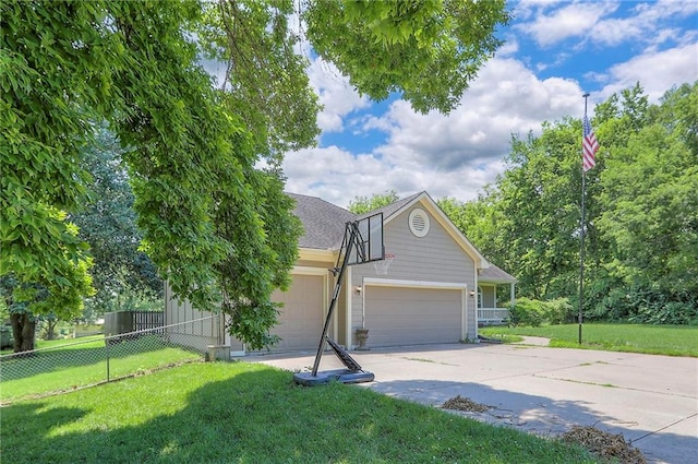 1875 E Mechanic Ave, Independence, MO 64050 - view of front of house featuring an attached garage and driveway