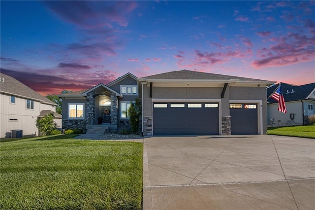 14814 Thousand Oaks Pl, Parkville, MO 64152 - view of front facade with stucco siding, driveway, an attached garage, a lawn, and stone siding