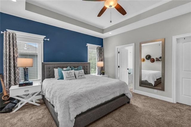 2409 SE Ridge Line Dr, Blue Springs, MO 64014 - carpeted bedroom with a tray ceiling, crown molding, baseboards, a ceiling fan, and recessed lighting