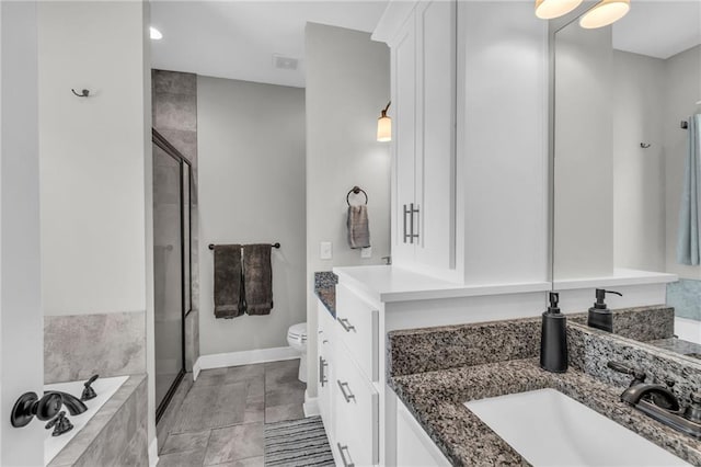 2409 SE Ridge Line Dr, Blue Springs, MO 64014 - full bathroom featuring a shower stall, vanity, toilet, a garden tub, and recessed lighting