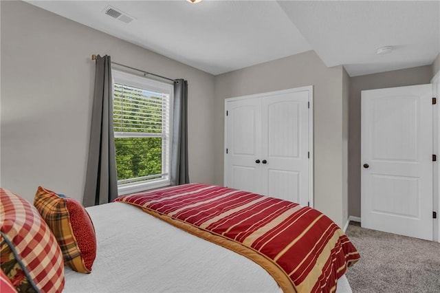 2409 SE Ridge Line Dr, Blue Springs, MO 64014 - carpeted bedroom with a closet and baseboards